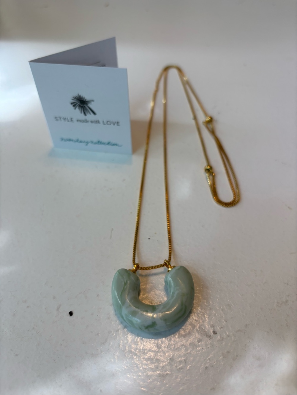 Noonday Collection Gold Necklace with Seafoam Green Marbled U Pendant